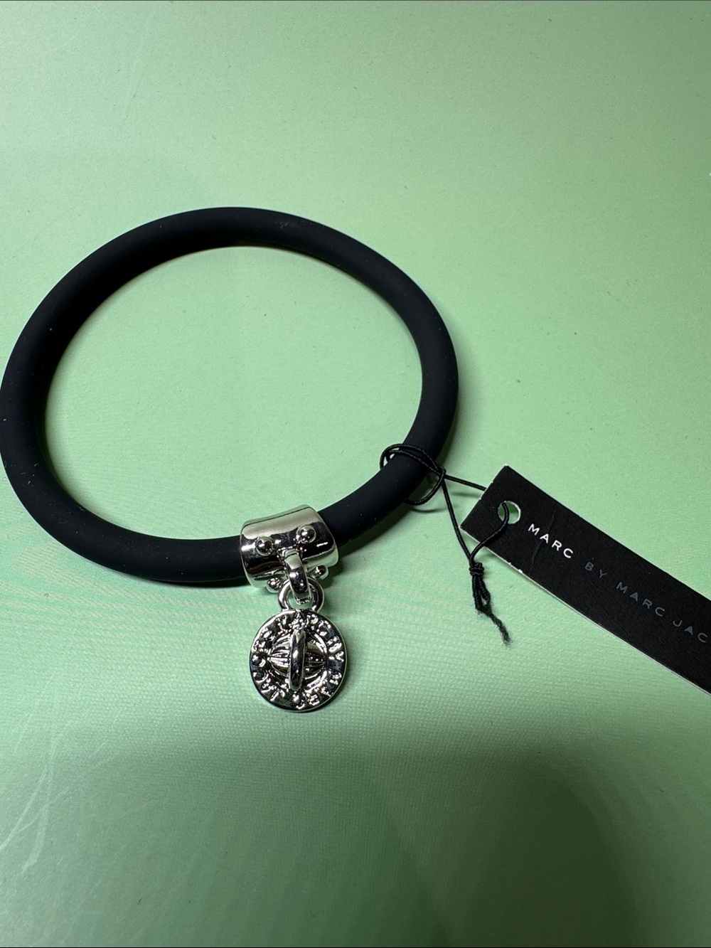 Marc by Marc Jacobs Black Silicone Bracelet with Silver Tone Medallion Charm